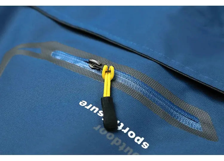 TRVLWEGO blue waterproof hiking jacket with yellow zipper pull by Simples Market