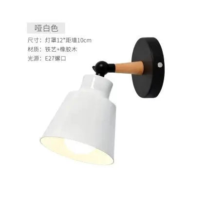 Nordic solid wood LED wall lamp with white shade and wooden arm on a black round wall mount by Simples Market