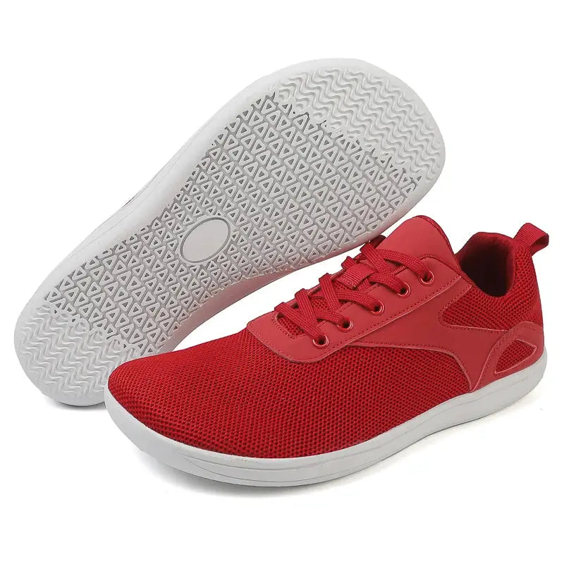 Wide-toed red mesh casual sports shoes with a white rubber sole.
