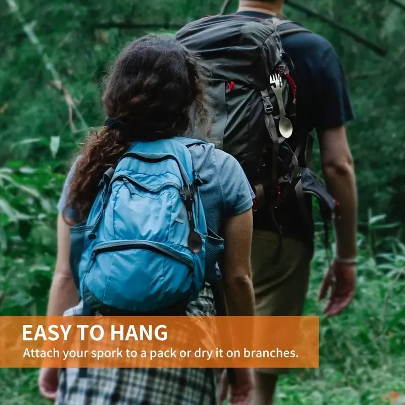 PSKOOK 5-in-1 outdoor spork tool attached to a blue hiking backpack on a forest trail.