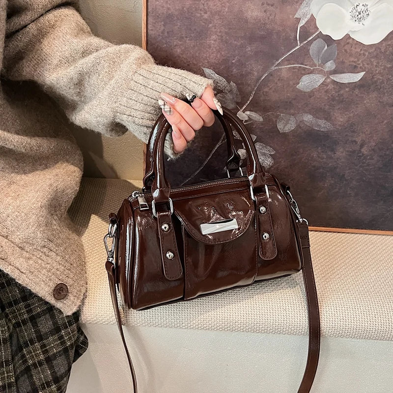 Burgundy mini top-handle bag for women in glossy PU leather with detachable crossbody strap and front pocket