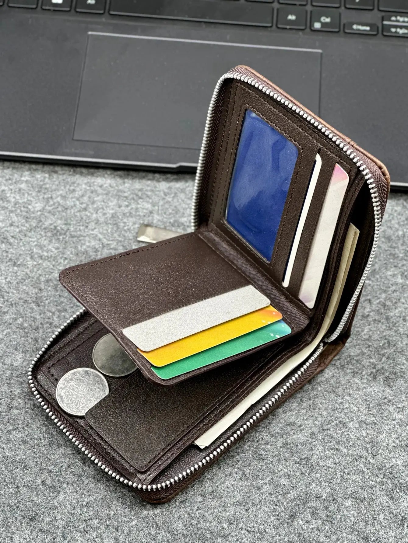 Zippered slim men's PU wallet in brown leather, open to show card slots with colorful cards and a coin pocket.