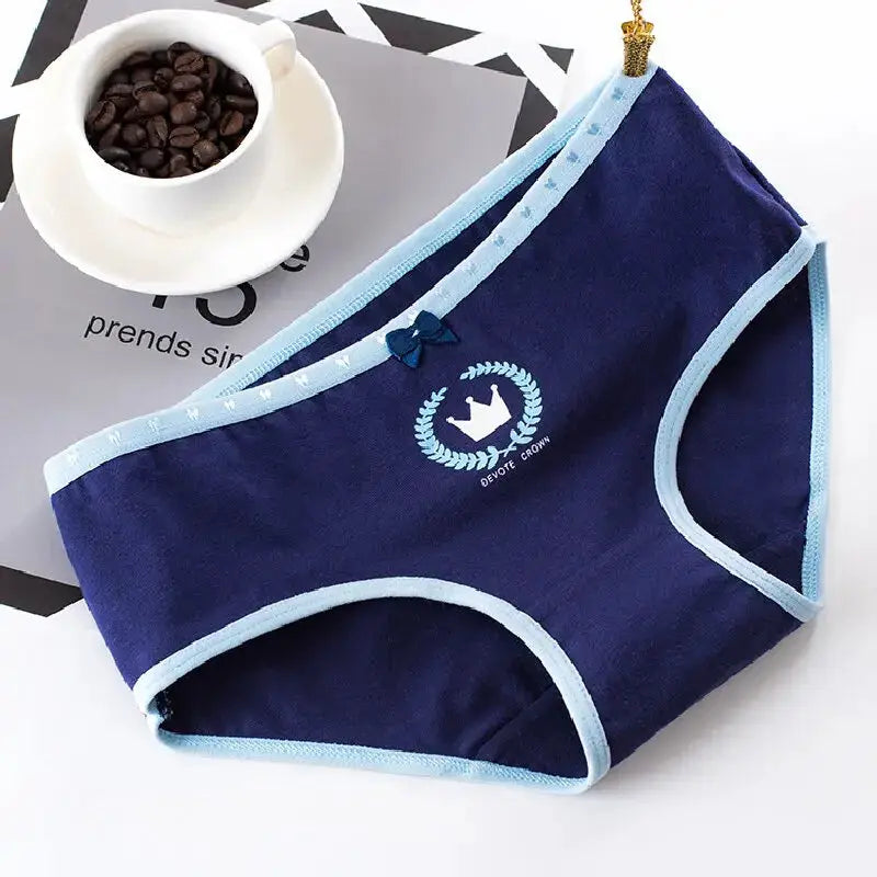 Women’s navy blue cotton seamless panties with light blue trim and a small bow