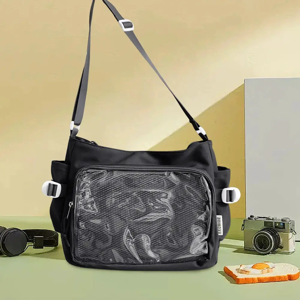 Simples Market black Ita bag with clear front window, multiple pockets, adjustable strap.