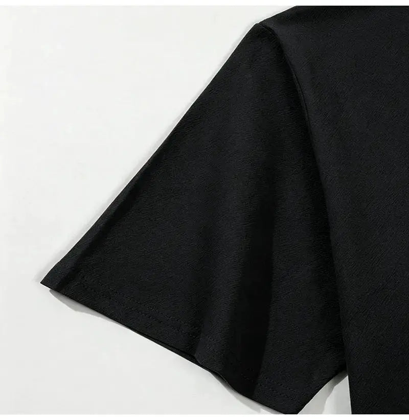 Men's black short-sleeve shirt close-up fabric texture for casual wear