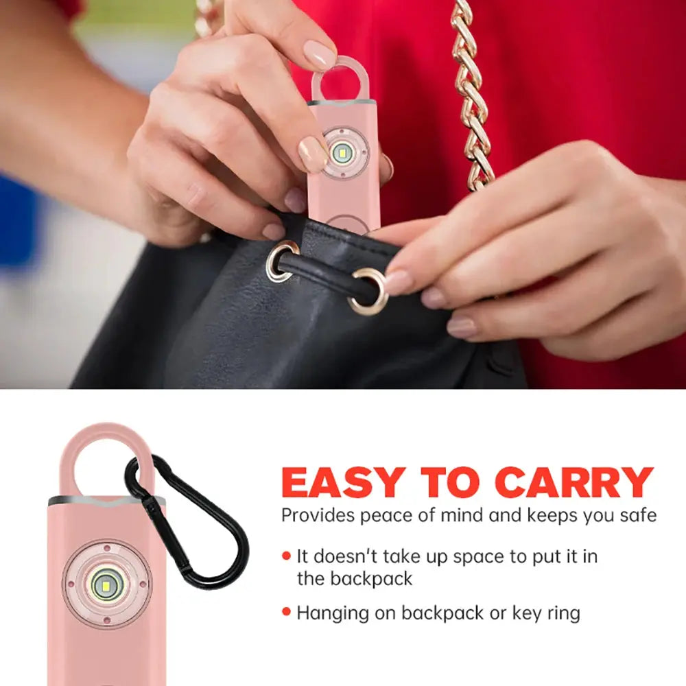 Pink 130dB rechargeable personal alarm keychain with LED flash and carabiner