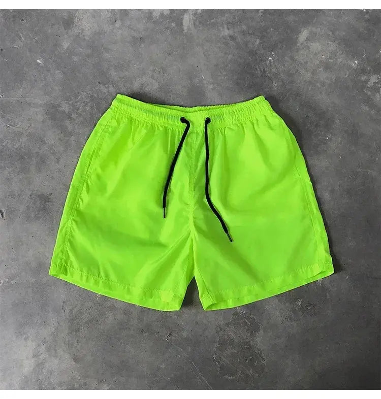 Men's neon green swim shorts with black drawstrings and elastic waist