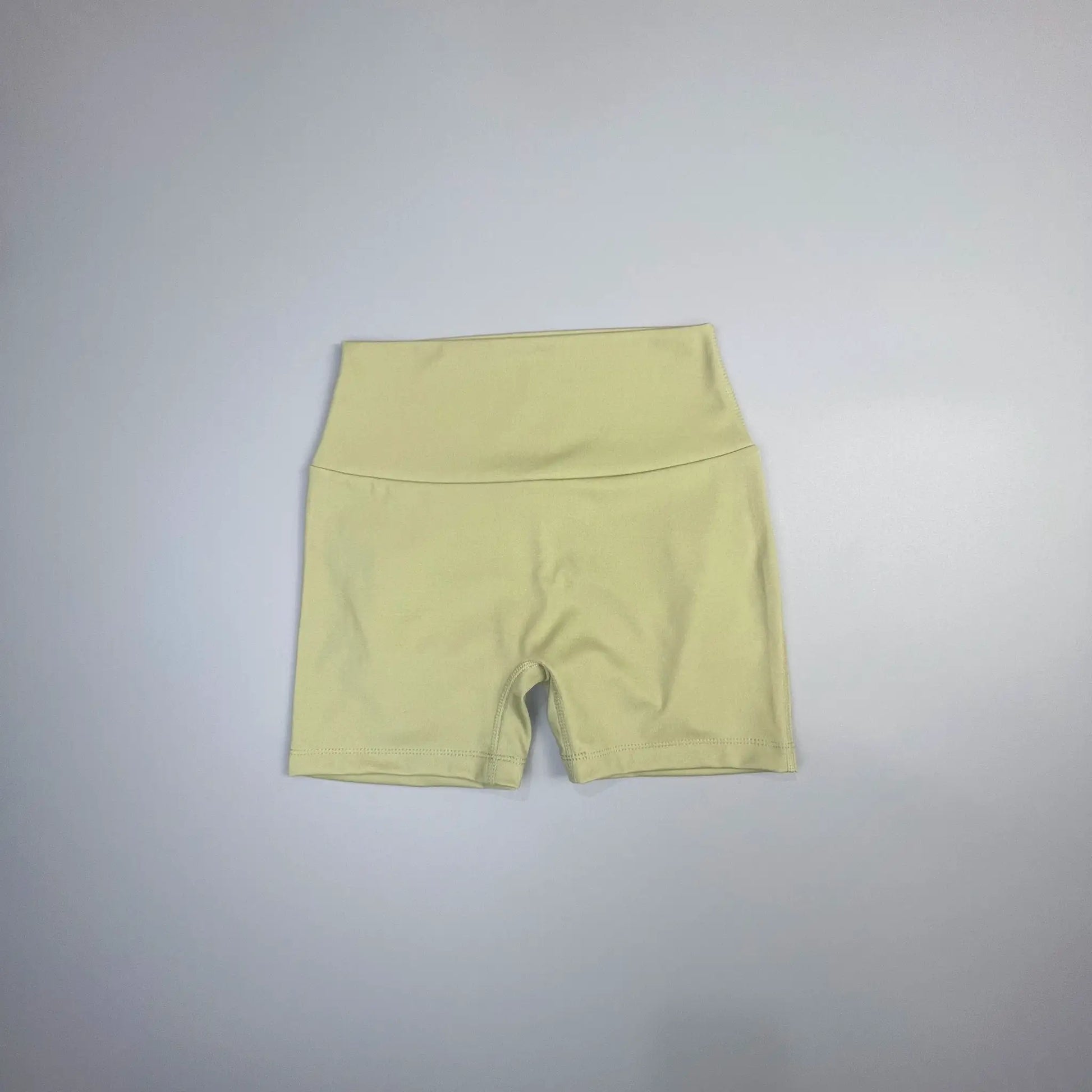 Peach Butt Fitness Shorts for women in pale yellow fabric with drawstring waist