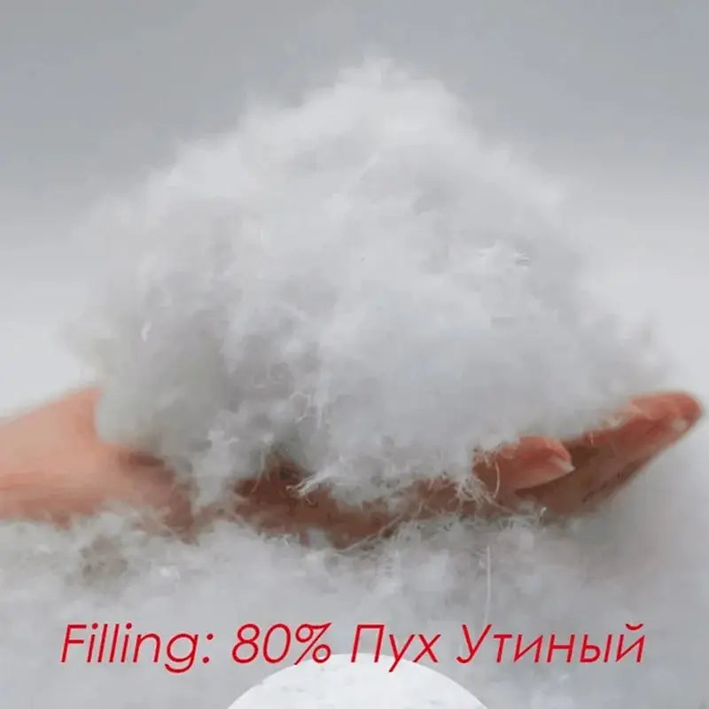 Men's duck down filling close-up; white fluffy down, 80% duck down
