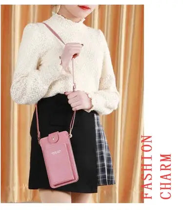 Pink soft-leather crossbody wallet purse with phone slot and adjustable shoulder strap.