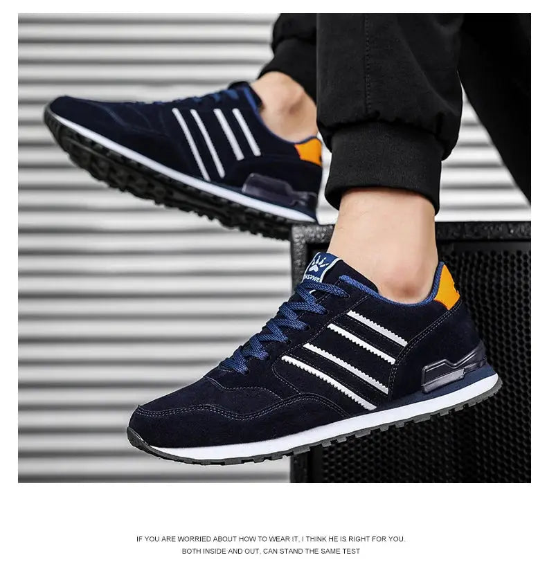 Simples Market navy artificial leather men’s lace-up casual sneakers with white stripes and orange heel tab.
