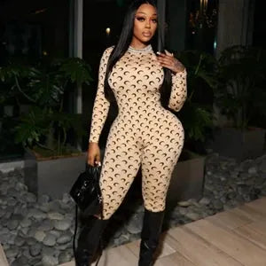 Womens jumpsuit with moon print, beige tan with black side panels, long sleeves, tight fit