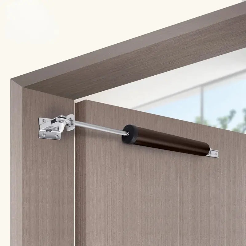 Automatic door closer with soft-close buffer for 90-degree stops; brown cylindrical damper with metal rod
