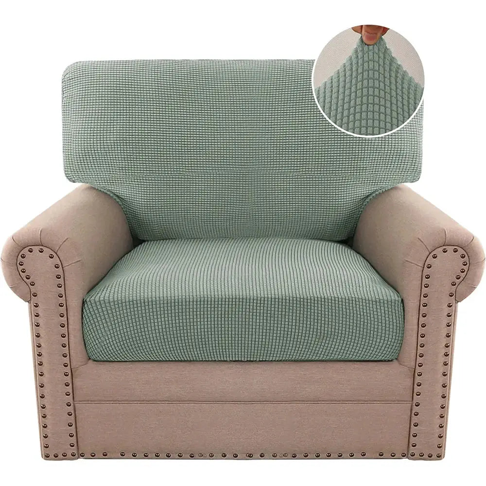 Stretchable jacquard sofa cover in teal polar fleece on an armchair