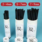Charcoal sticks set, 25 pcs, black drawing charcoal in three sizes (2–4mm, 5–7mm, 7–9mm) in white tubes