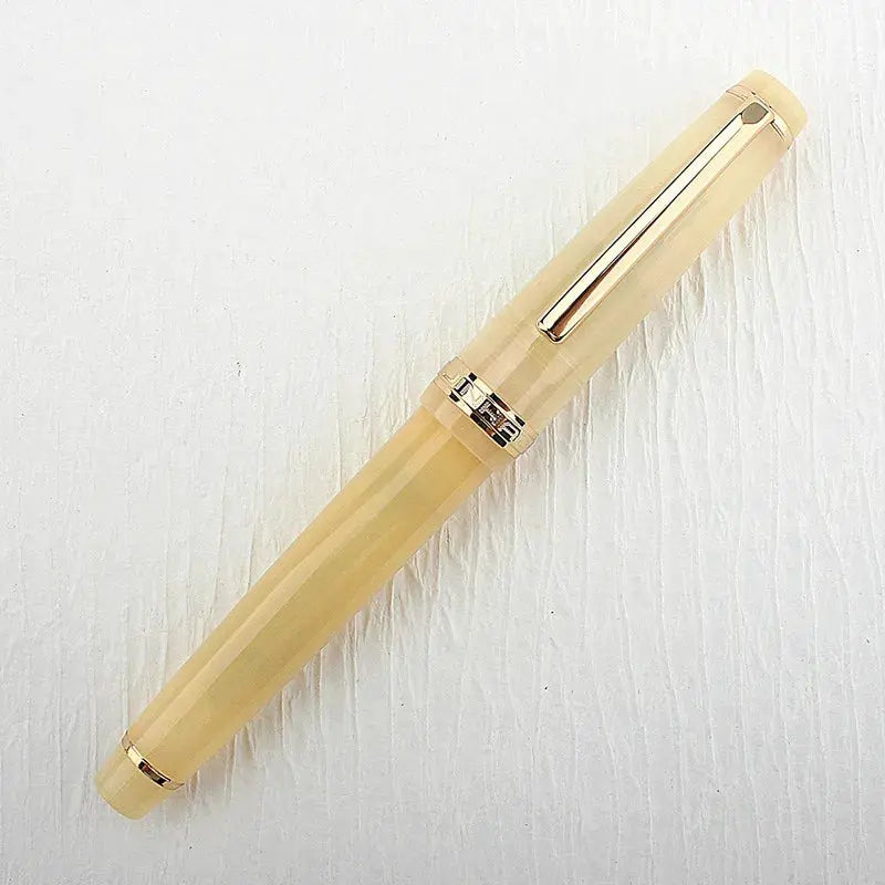 Jinhao 82 fountain pen in beige acrylic with gold trim and converter