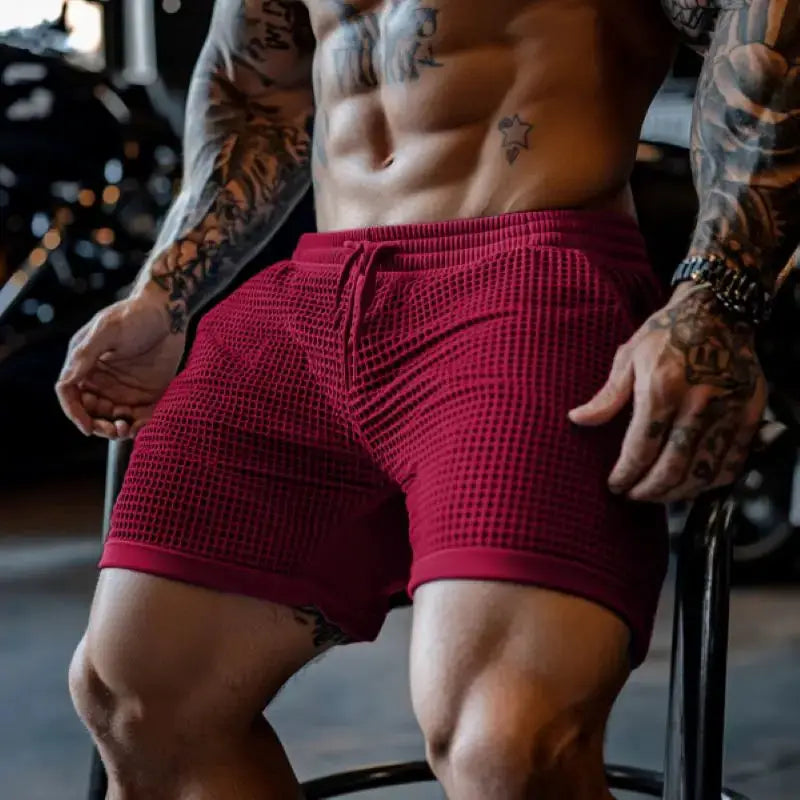 Men's oversized stretch waffle shorts in red with elastic drawstring waist for gym