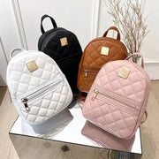 Embroidered quilted backpack set for women in white, black, tan, and pink with gold zippers