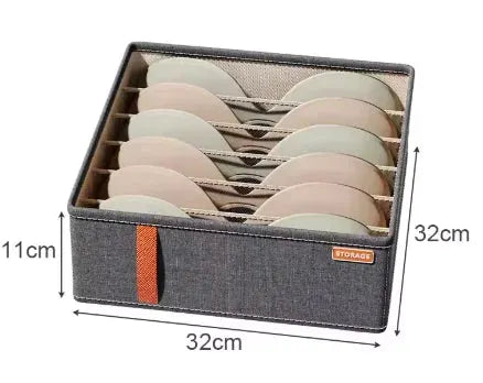 Closet underwear organizer storage box in gray fabric with orange strap; foldable with divider slots