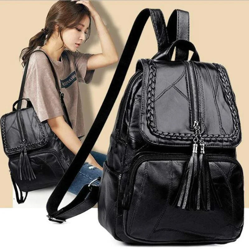 Mini black men's backpack with braided trim and tassel zipper pulls, adjustable shoulder strap