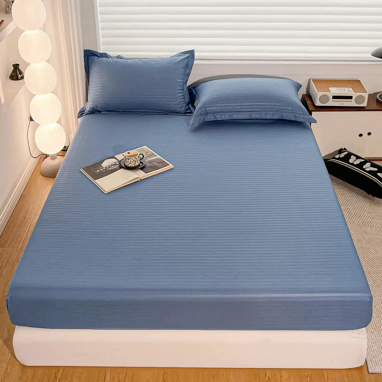 Fitted blue bed sheet with elastic band for single to king beds; solid color soft mattress cover