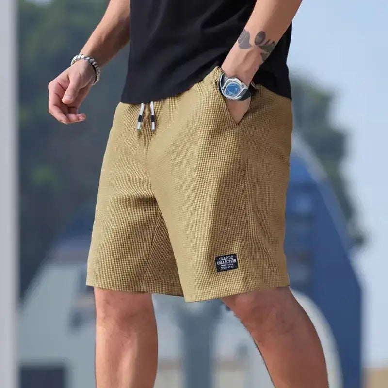 Men's textured beige shorts with drawstring waist and front pockets