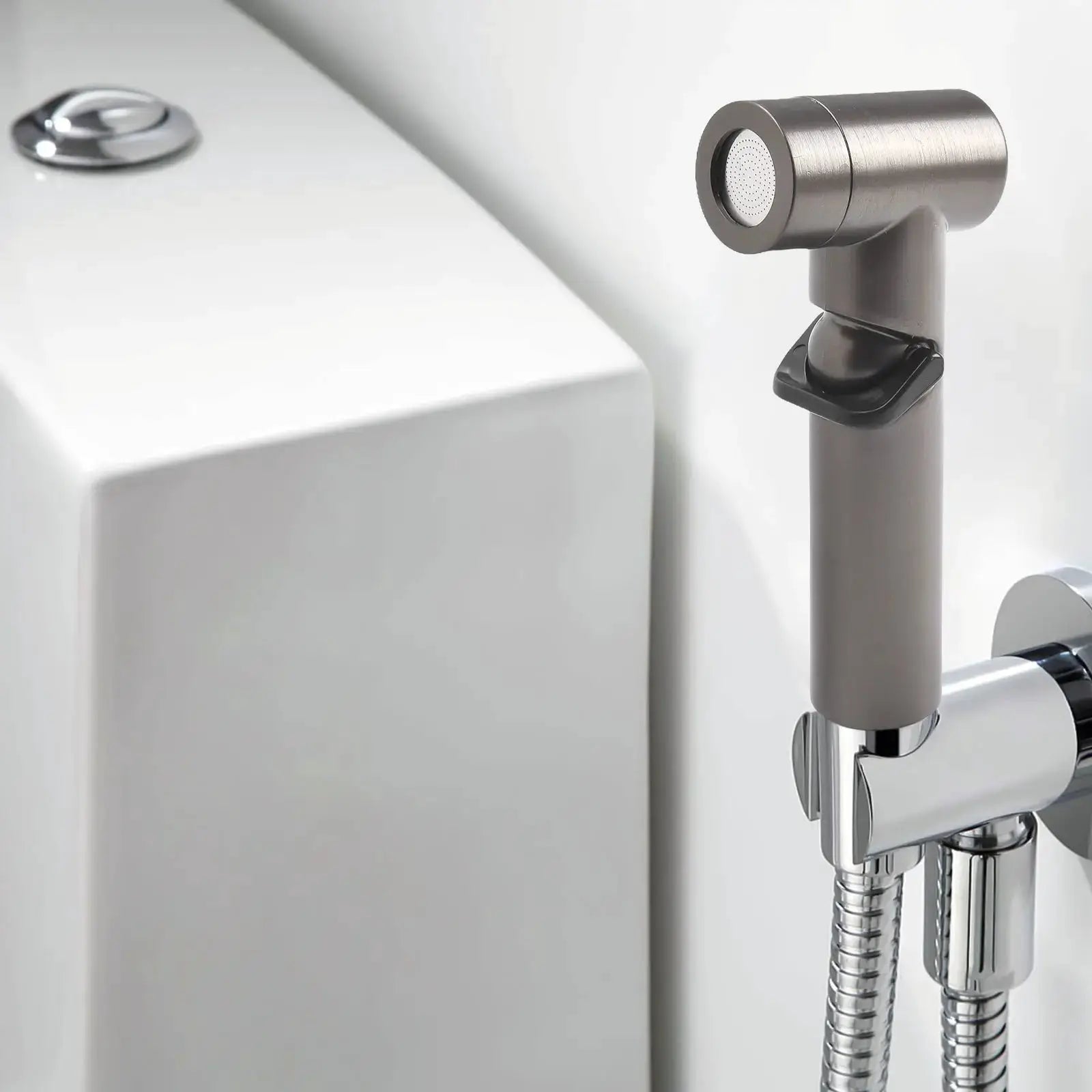 Handheld ABS spray shower head by Simples Market with brushed metal finish and stainless hose
