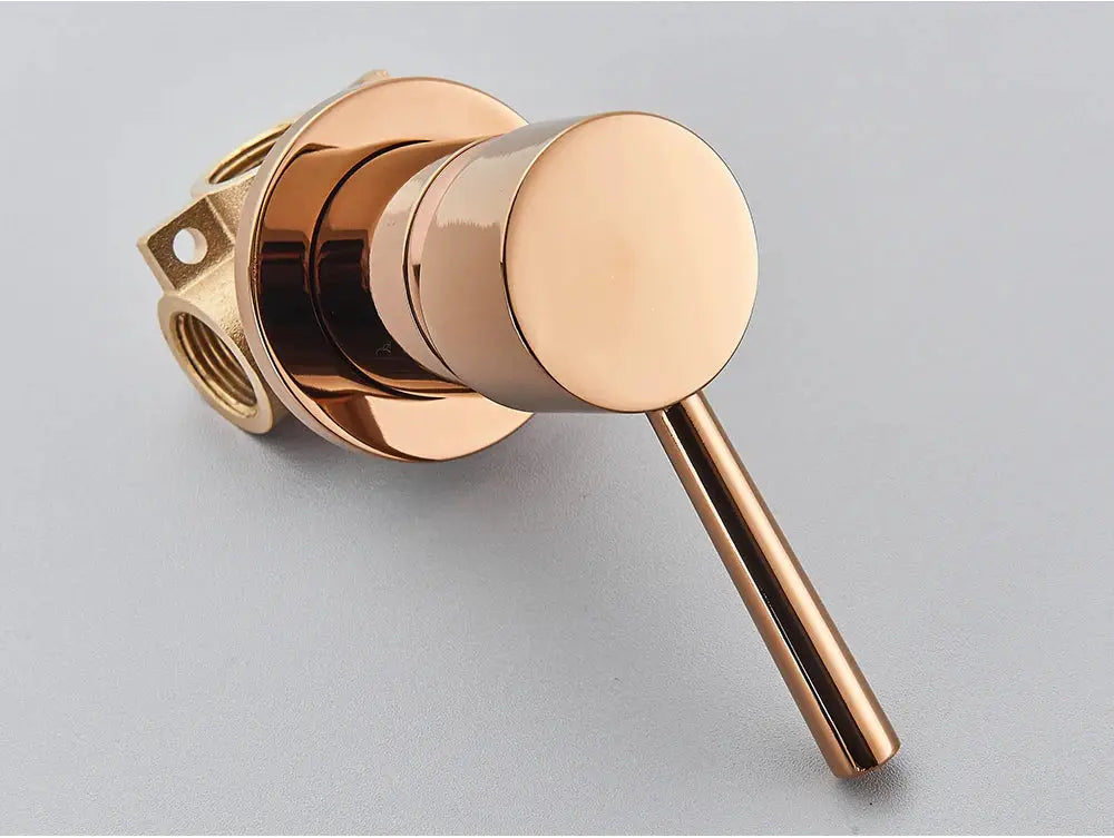 Brass bathroom mixer valve with rose-gold round knob and concealed mounting hardware for sleek, minimal faucet control
