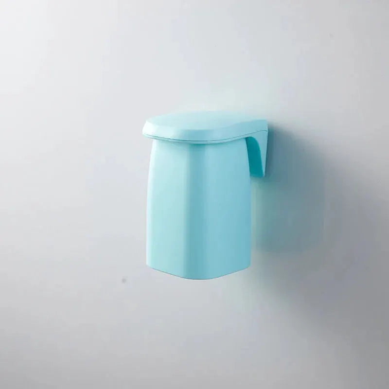 Magnetic mouthwash cup wall-mounted toothbrush holder in mint blue plastic by Simples Market