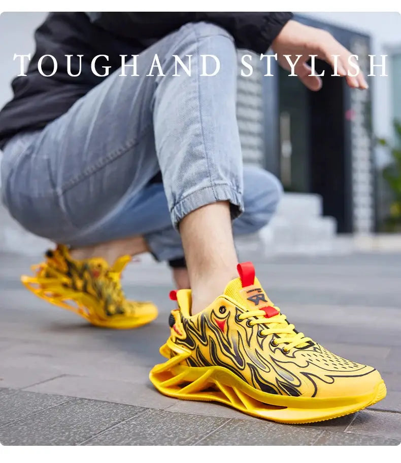 Men's yellow flame-pattern sneakers, two sneakers visible on urban pavement