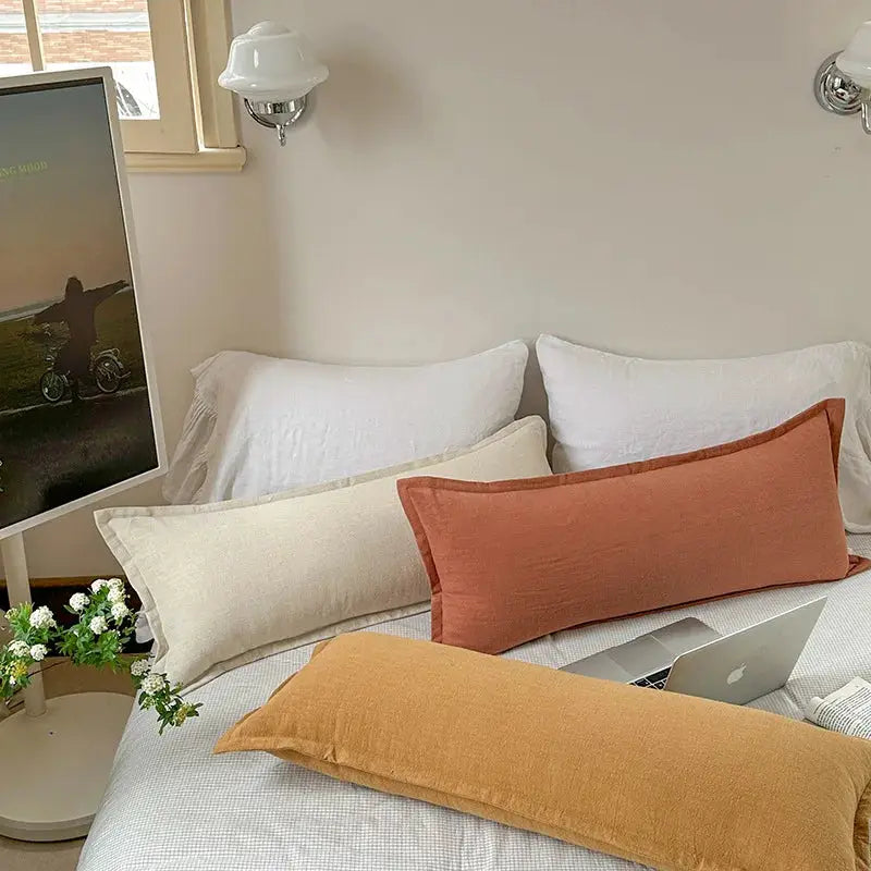 Decorative ramie cushion cover set of three in rust, cream, and mustard for chair, couch, or sofa.