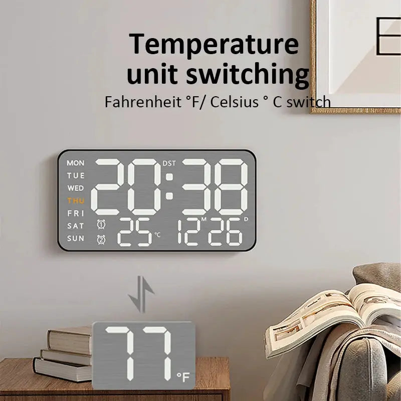 Simples Market mirror-brushed wall clock with large digital time/temperature display; paired with a 77°F desk clock.