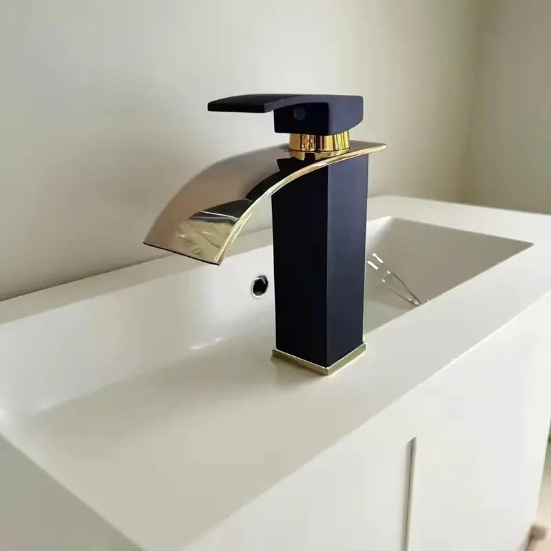 Waterfall wash basin faucet in black with gold accents and chrome spout, Simples Market