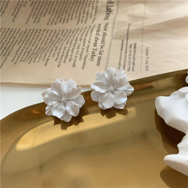 Simples Market white flower stud earrings; camellia design pair for women, modern Korean fashion jewelry
