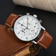 Wristwatch by Zeppelin: automatic chronograph with white dial, silver case, brown leather strap.