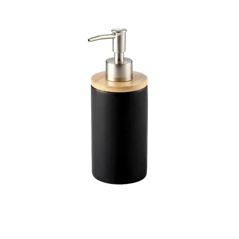 Ceramic soap dispenser with black cylindrical body, wooden lid, stainless steel pump