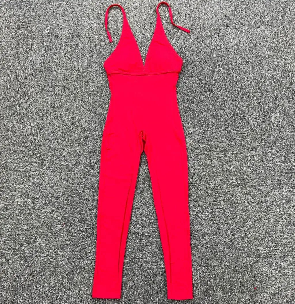 Women's pink padded yoga jumpsuit with adjustable straps and V-neck