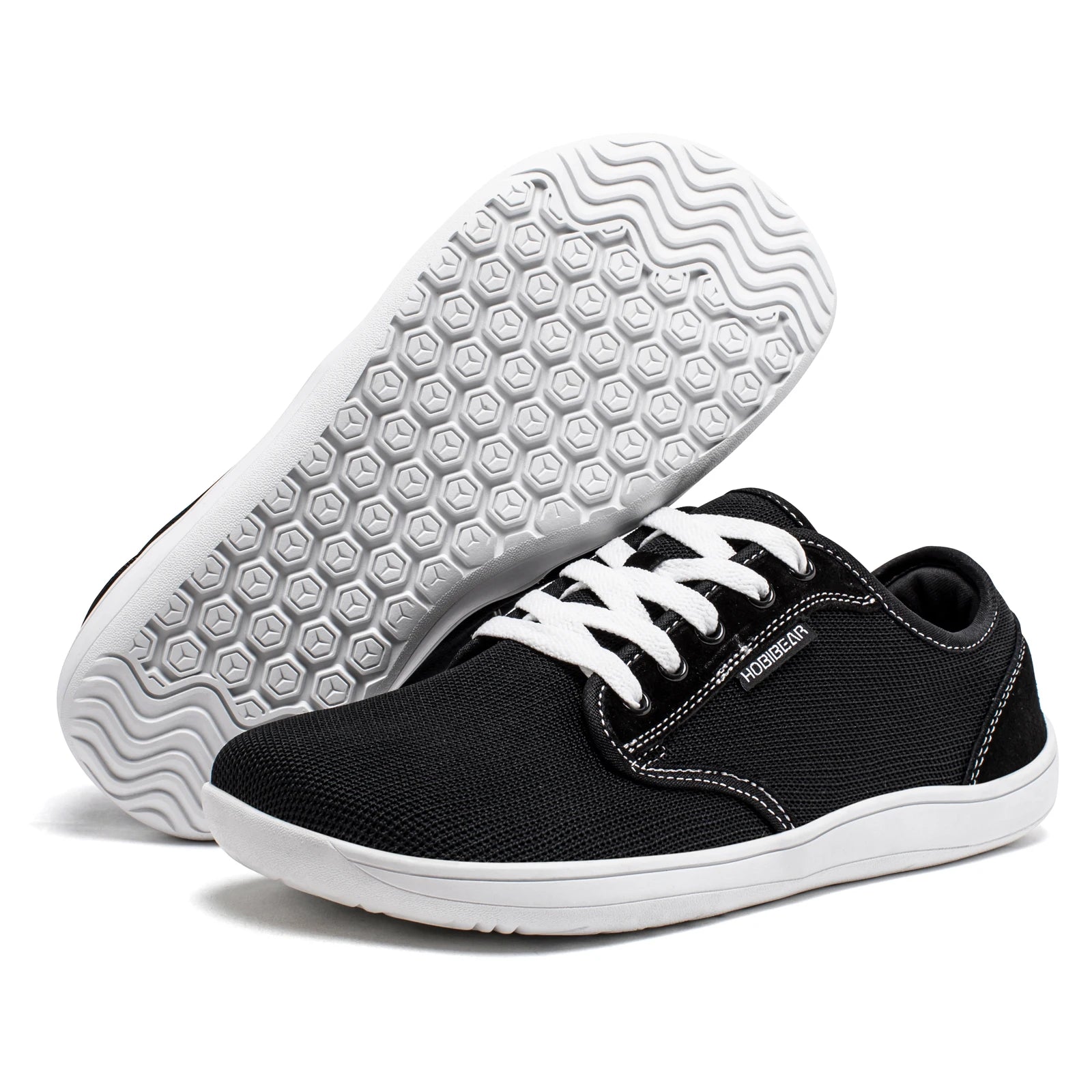 HOBIBEAR men's minimalist barefoot shoes; black fabric upper with white sole and laces, hex-pattern outsole.