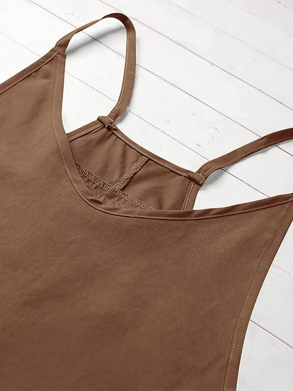 Women's brown jumpsuit with spaghetti straps and a loose-fit silhouette.