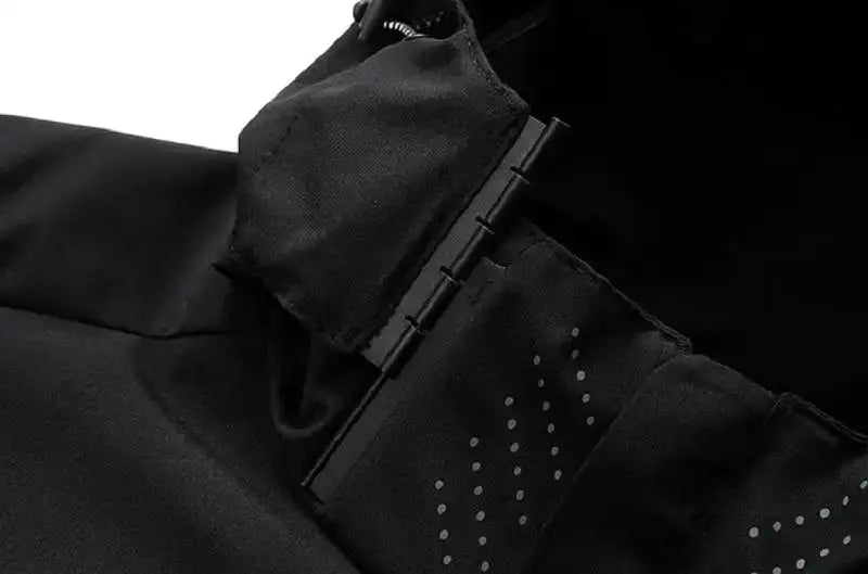 Men's black waterproof hooded rain jacket with adjustable cuffs and reflective dotted accents