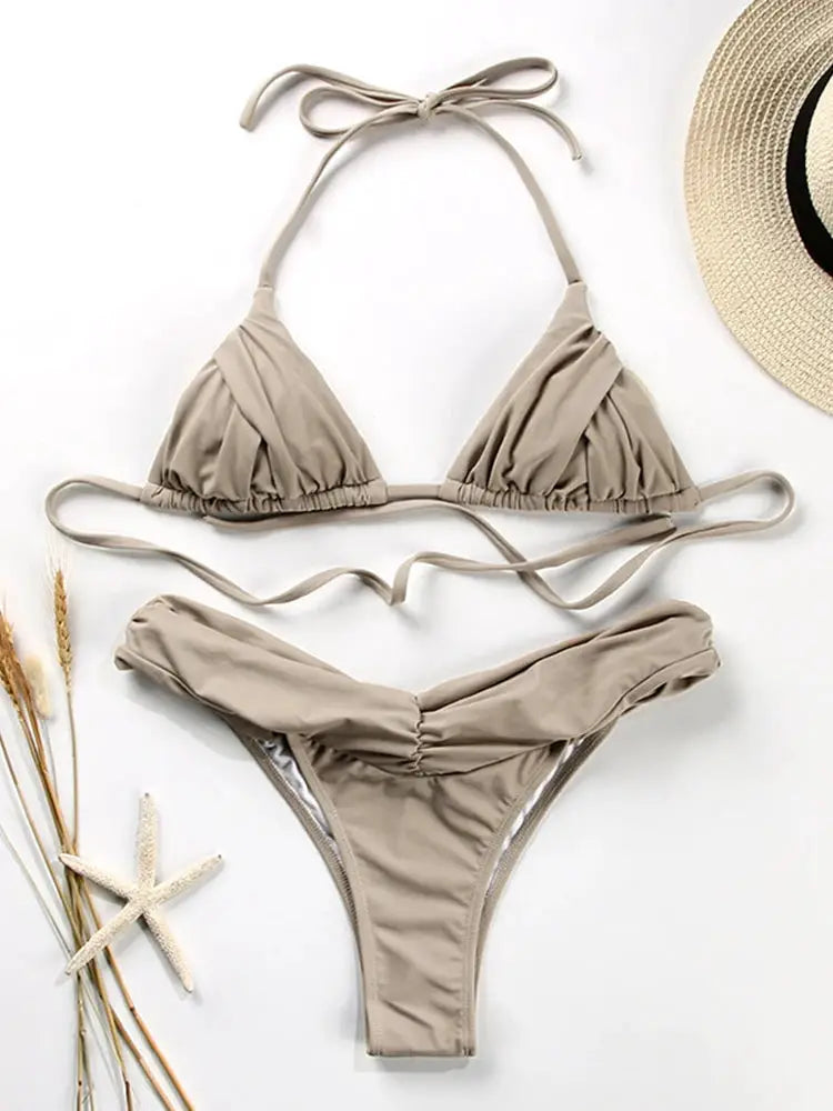 Beige string bikini set with ruched triangle top, ruched front bottoms, and tie sides