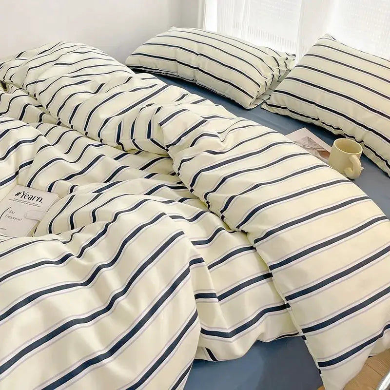 Simples Market four-piece duvet cover and sheet set in cream with navy stripes, washed cotton bedding