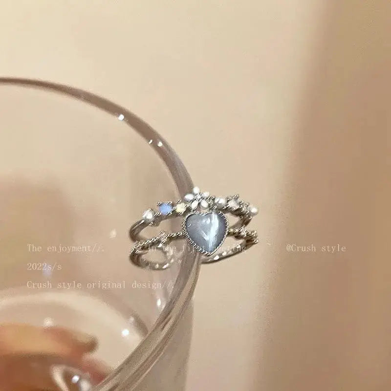 Goth Punk open ring with heart-shaped blue crystal centerpiece and silver-tone bands