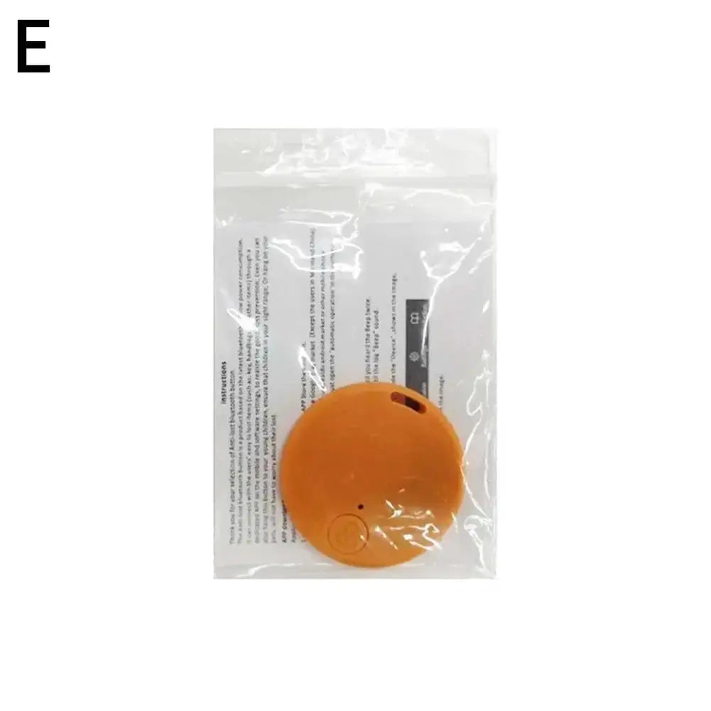 Round orange GPS Bluetooth 5.0 anti-lost tracker for pets in plastic packaging