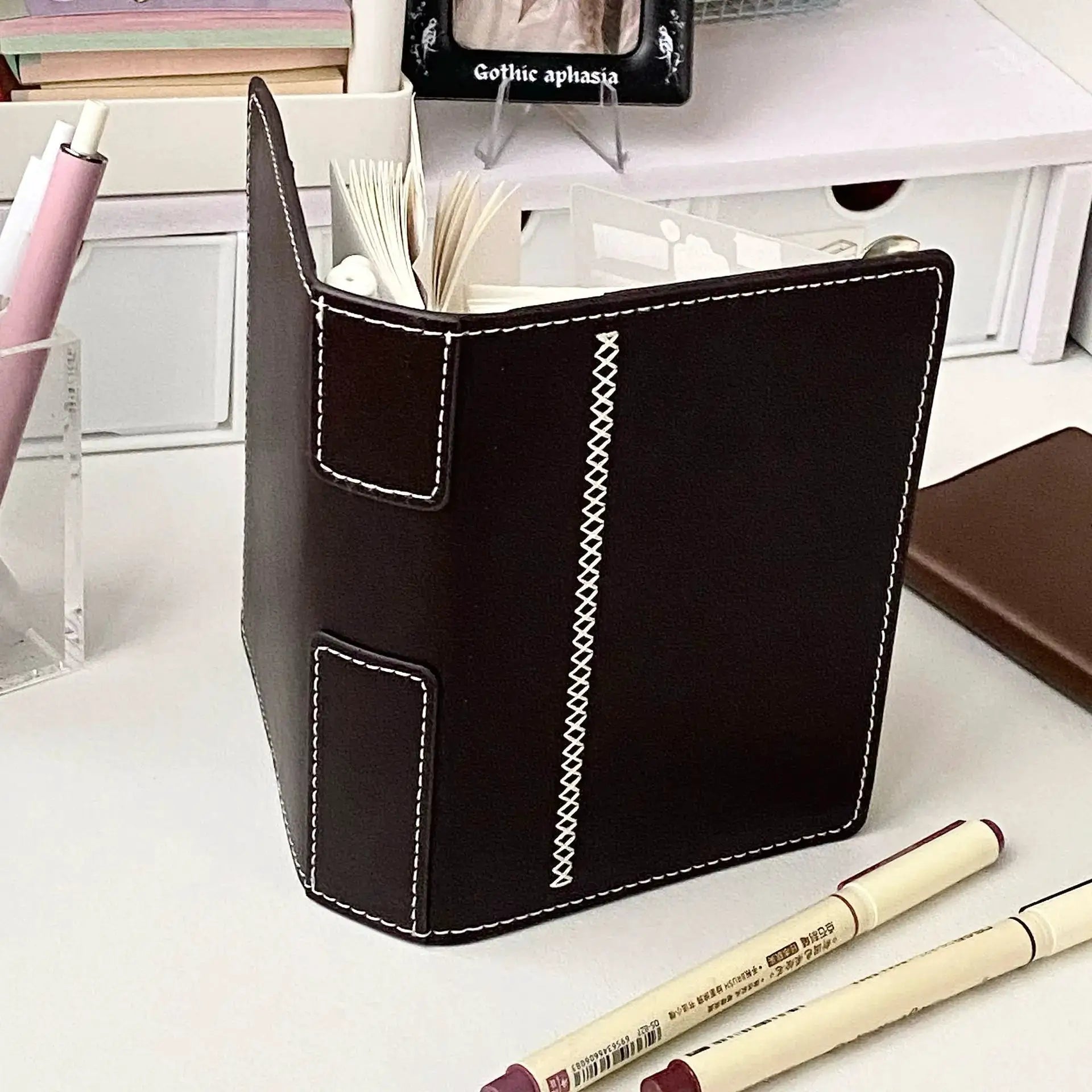 2 Binders A7 notebook in dark brown faux leather with detachable loose-leaf pages and white stitching