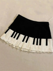 Skirt Simples Market black and white mini skirt with piano-key-inspired layered pleated hem