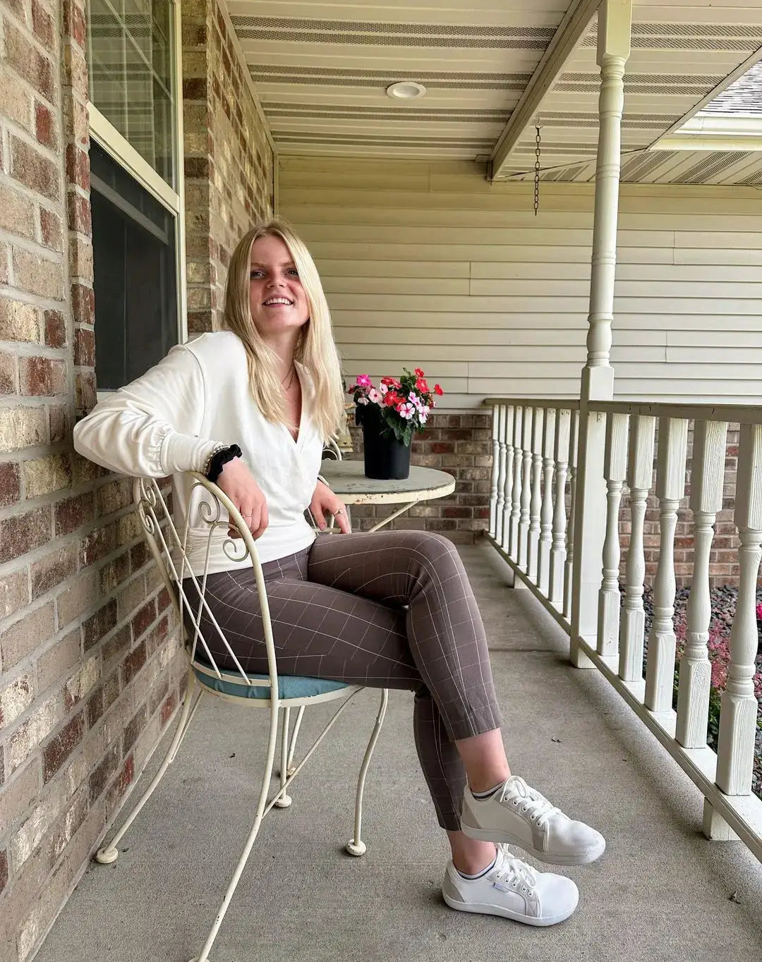 HOBIBEAR unisex wide-toe barefoot shoes in white, worn by a woman on a porch