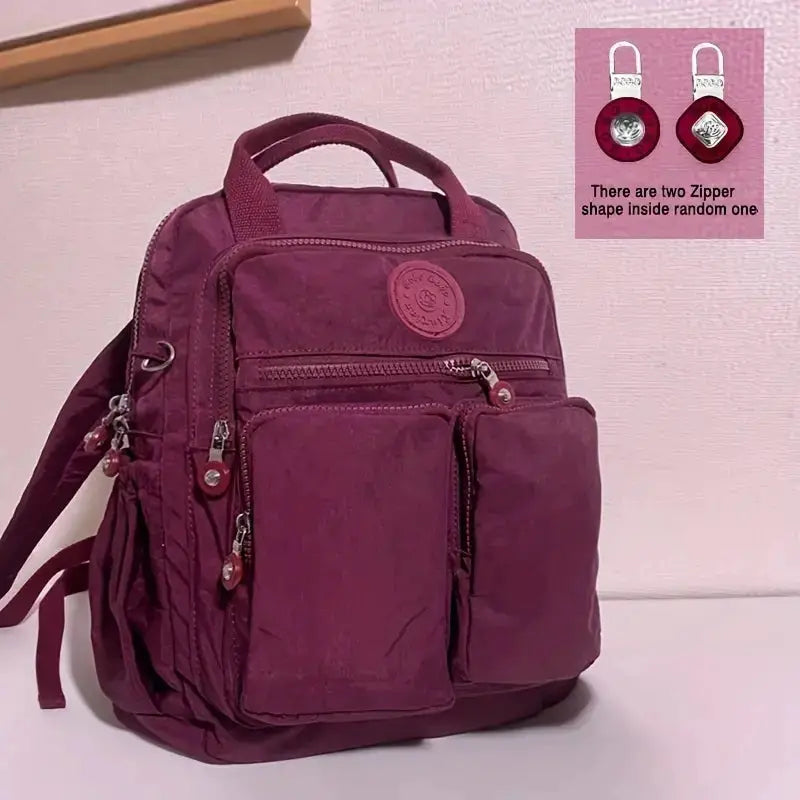 Simples Market purple waterproof nylon backpack with multiple zip pockets and top handle