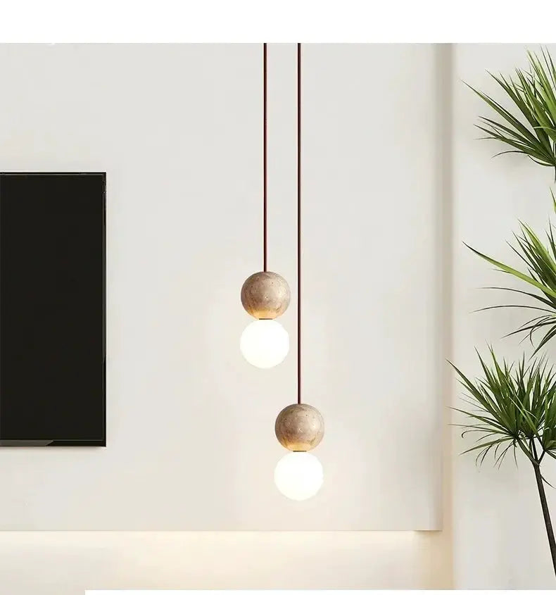Led Pendant Light Stone Cream by Simples Market; dual hanging pendant lamps with round stone balls and glowing bulbs.