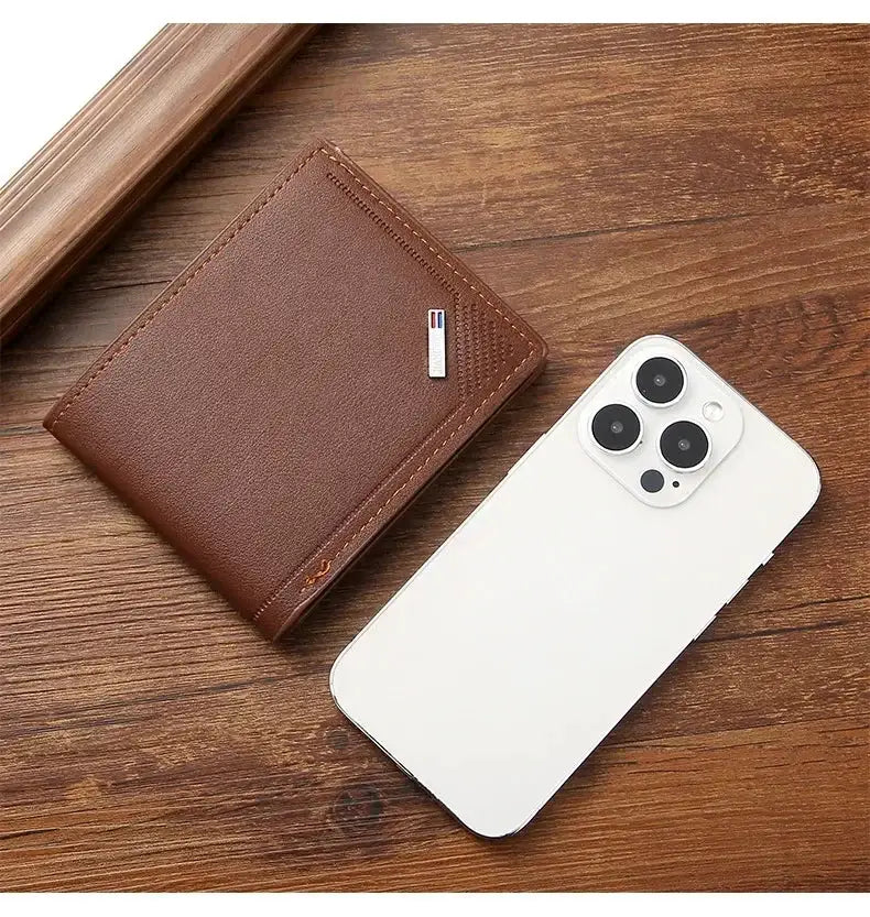 Men's soft brown leather slim wallet, foldable minimalist design, by Simples Market, shown beside a white smartphone.